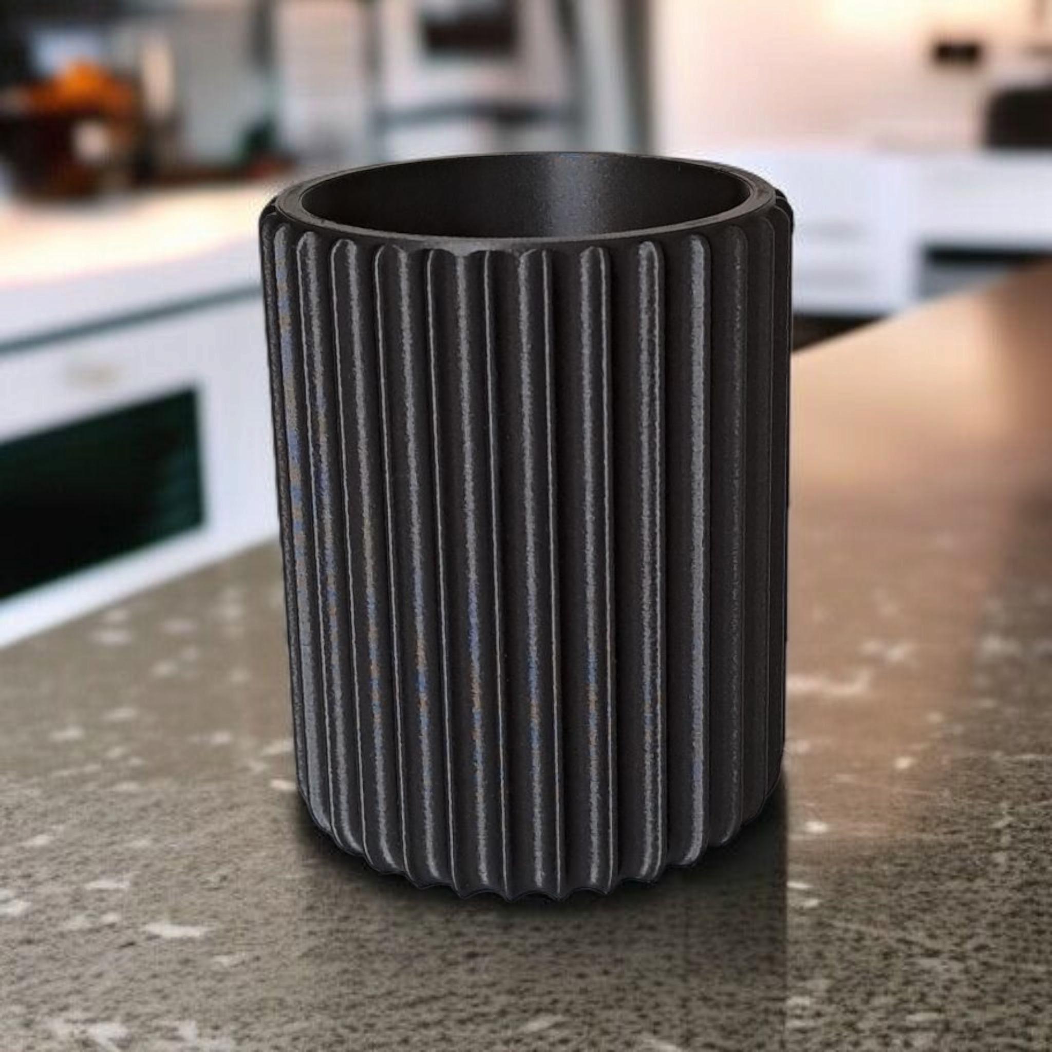 Ribbed pen, brush,  plant holder with fine surface structure