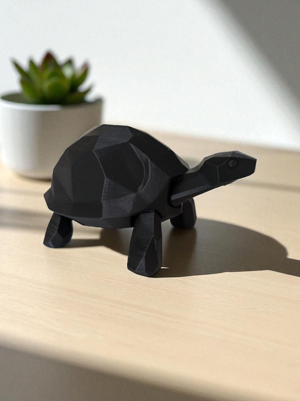 A modern low-poly walking turtle — minimalist design meets nature’s charm.