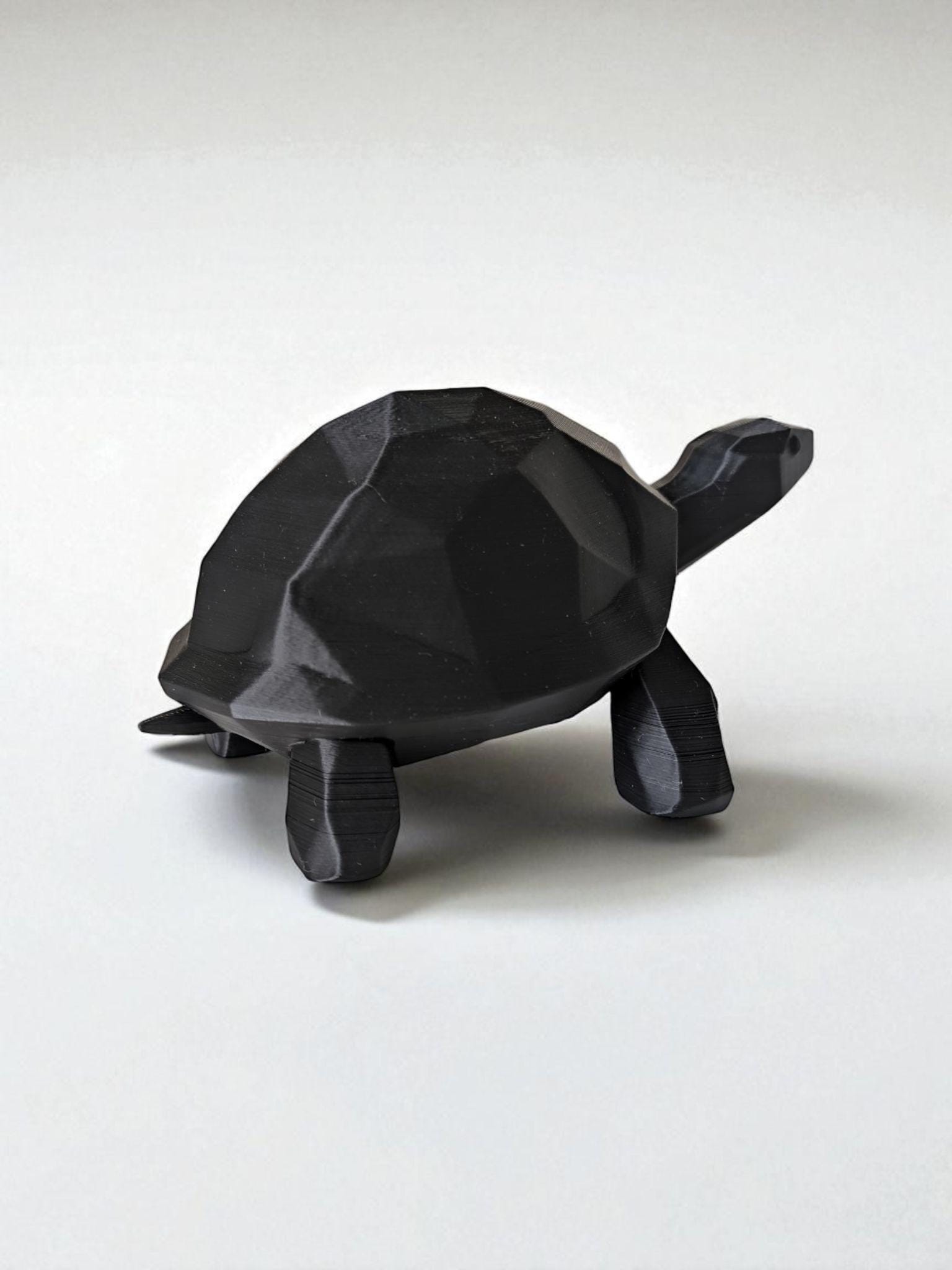 A modern low-poly walking turtle — minimalist design meets nature’s charm.